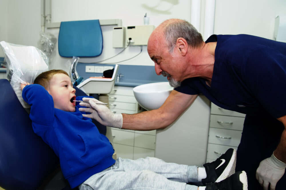 A small child being treated at Macleod Dental
